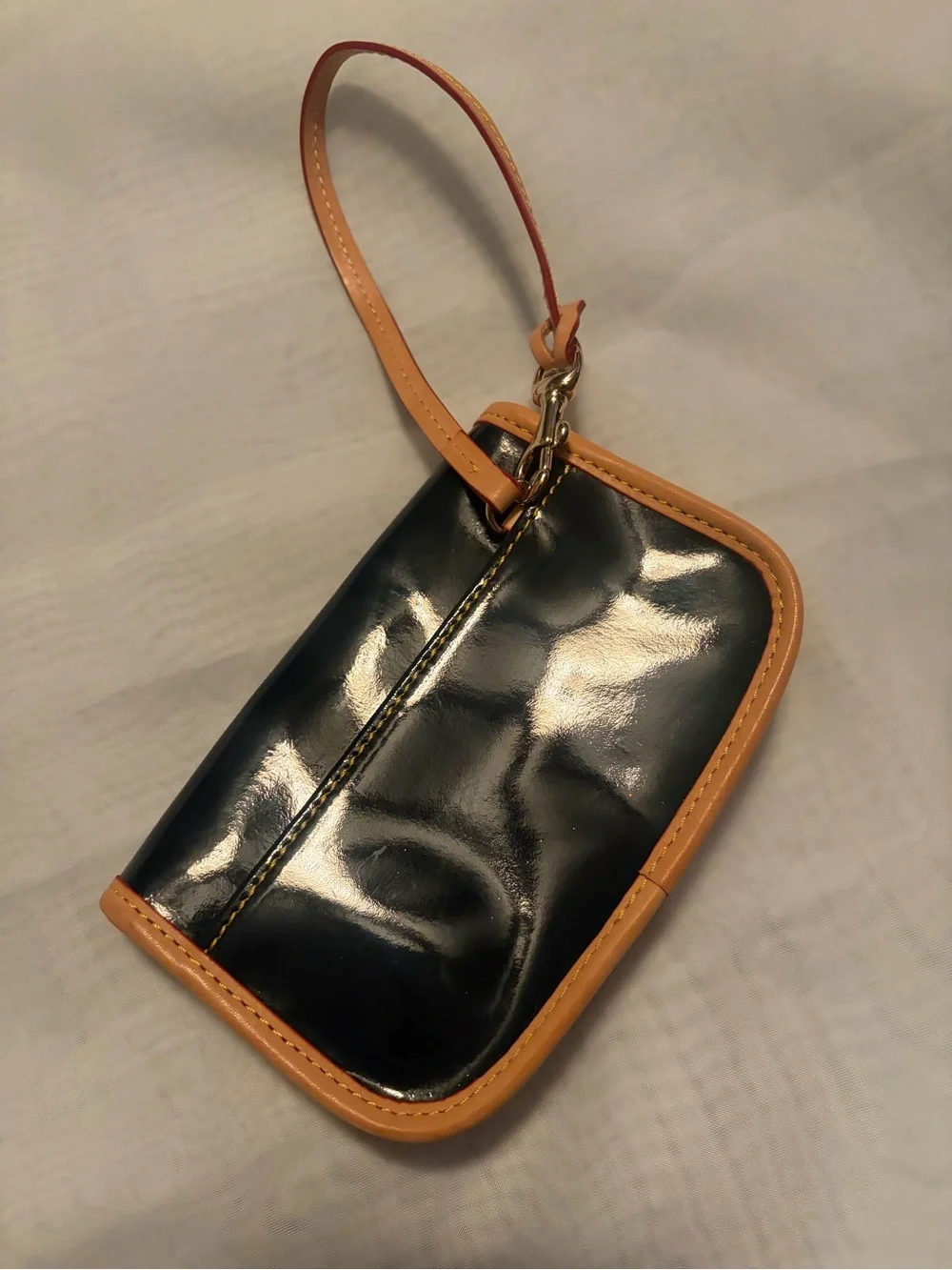 Dooney and Bourke Navy and Tan Patent Wristlet